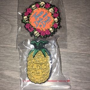 Three Dots and a Dash enamel pins.